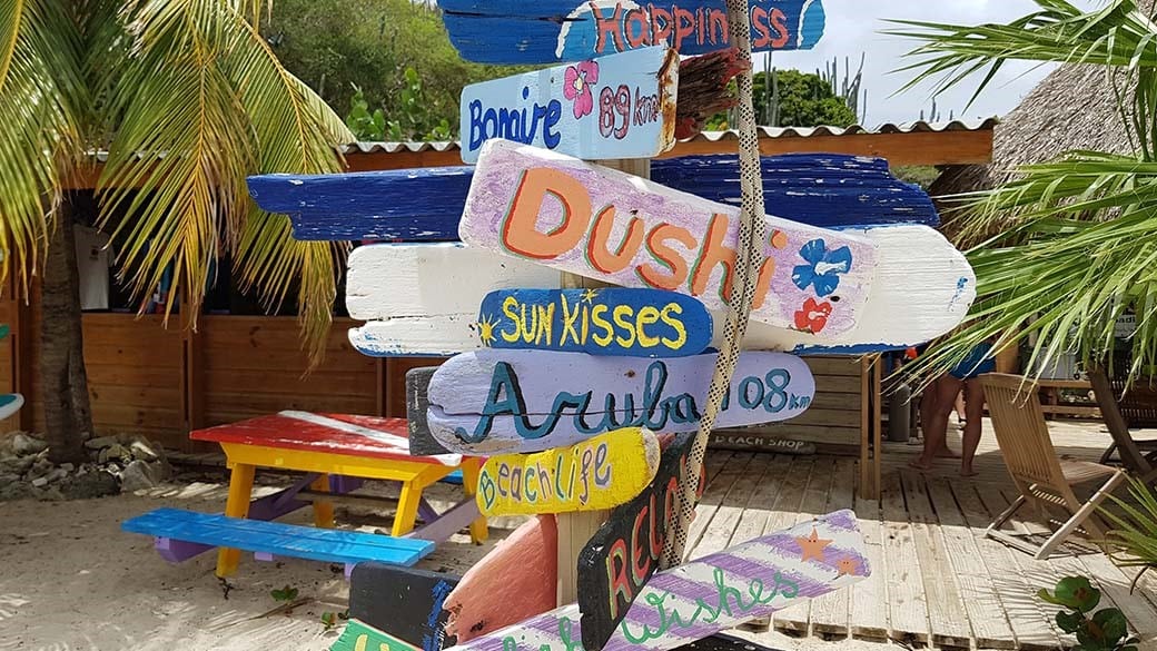 Colorful beach signs at Cas Abao