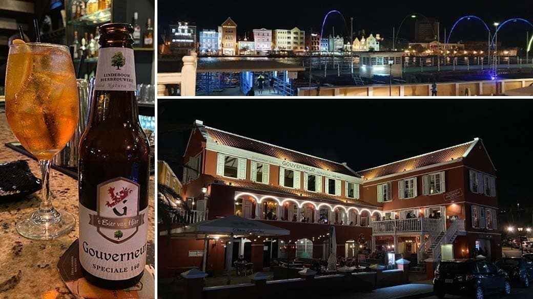 The Gouverneur restaurant, which serves its own beer, at the Sint Annabaai ferry pier in the evening with the Queen Emma Bridge open