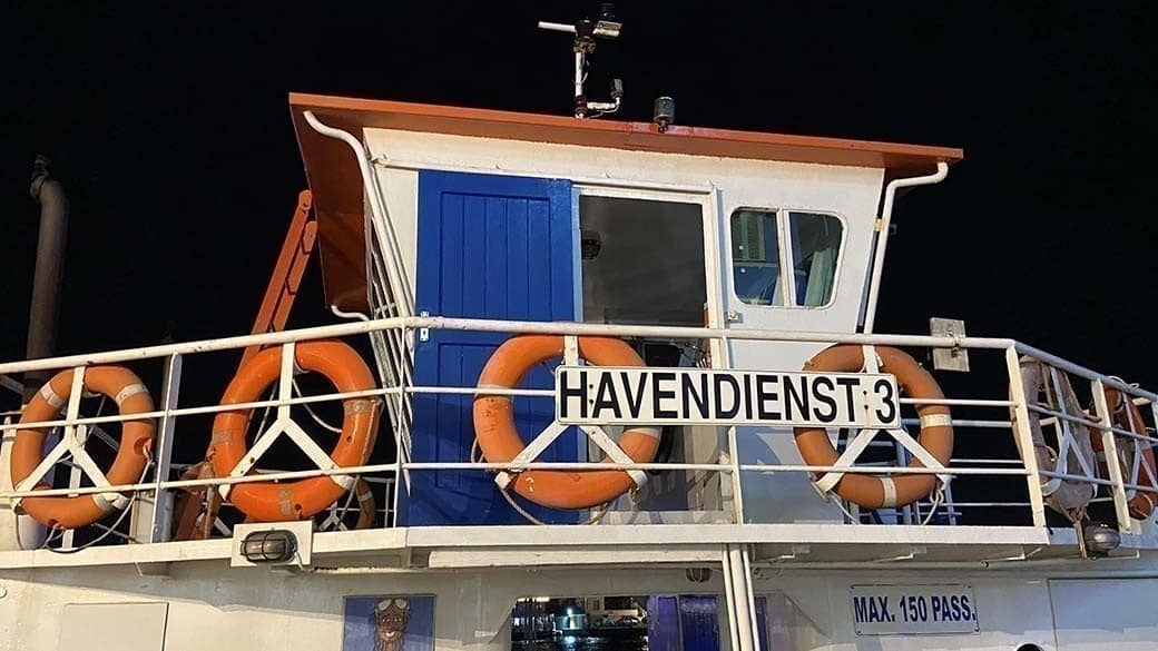 The driver's cab of a ferry boat at night