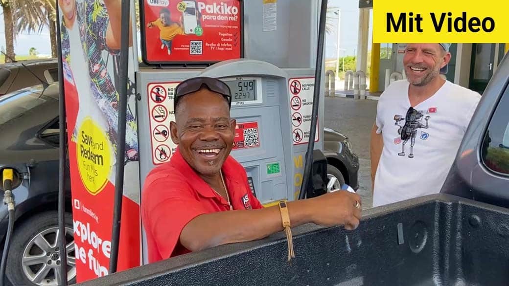 Having fun with the smiling and friendly gas station attendant